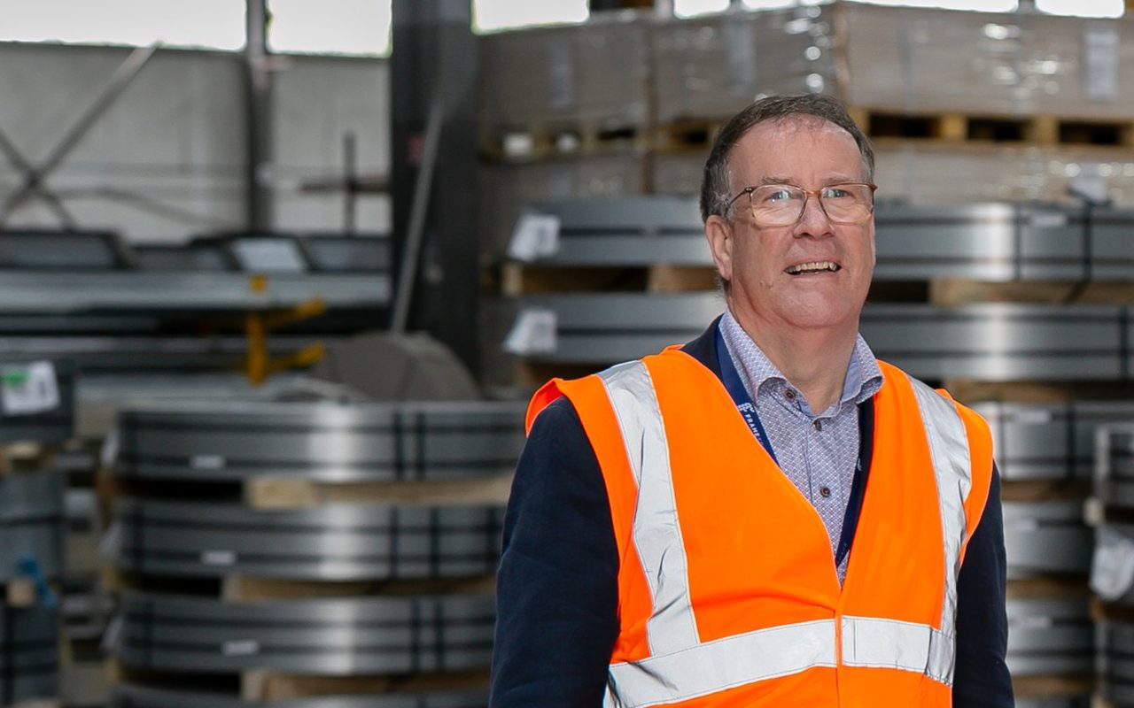 Framespace CEO Frank Madden in hi-vis on the factory floor in Longford